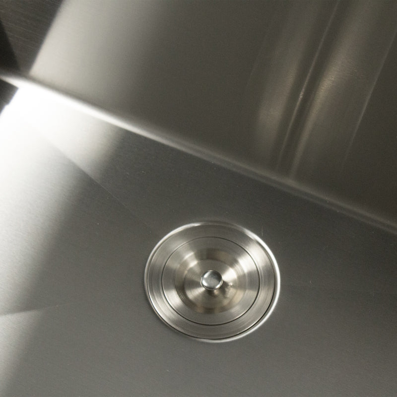Nantucket Sinks SR3018-12-16 close-up of the colander drain on the brushed bowl floor