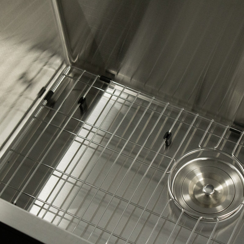 Nantucket Sinks SR3018-12-16 close-up of the bottom grid, bumpers and colander drain