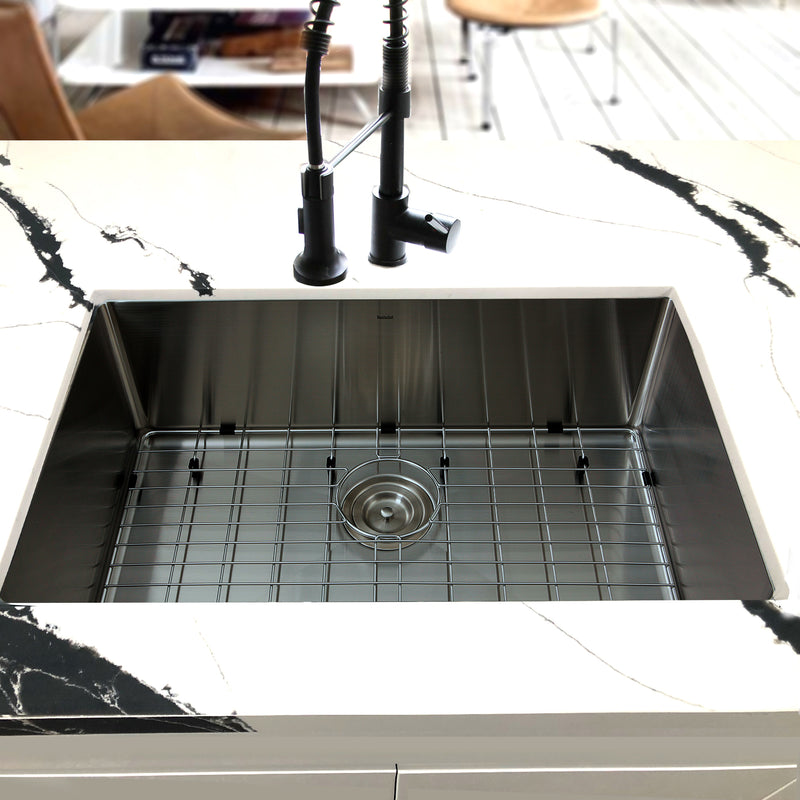 Nantucket Sinks SR3018 installed in black-veined marble with grid and black faucet
