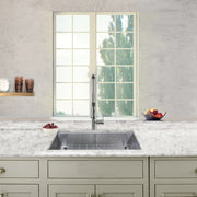 Nantucket Sinks SS-PRO-ZR3018-5.5 installed in a light quartz counter under a window