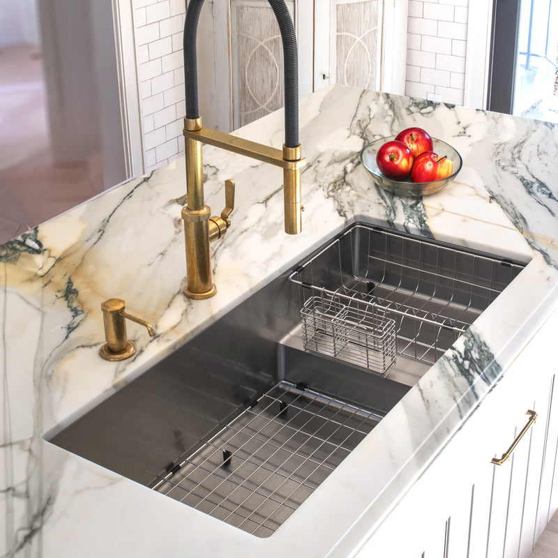 Nantucket Sinks STEPPE3918 installed in a gold-veined marble counter with the rinse basket