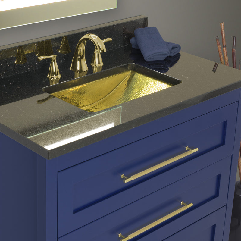 Nantucket Sinks TRB-OF brass trough sink undermounted in a dark counter on a navy vanity