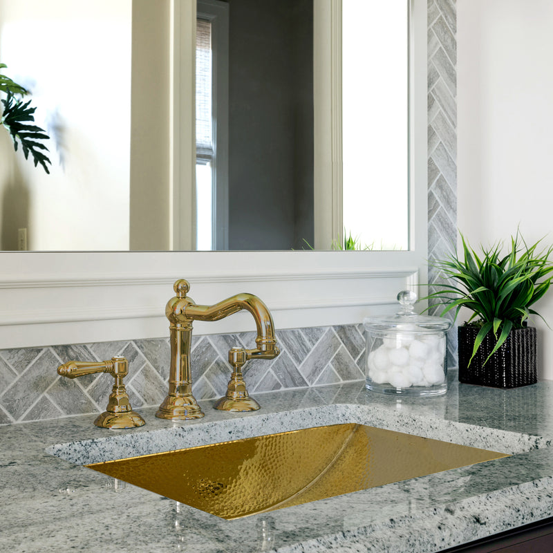 Nantucket Sinks TRB2416-OF brass trough sink undermounted in gray granite with a brass widespread faucet
