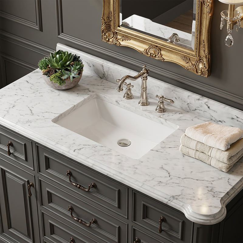 Nantucket Sinks UM-19x11-W white undermount sink in a marble vanity with a nickel widespread faucet