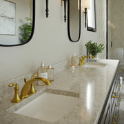 Nantucket Sinks UM-2016C-W white undermount sinks in a stone double vanity with gold faucets