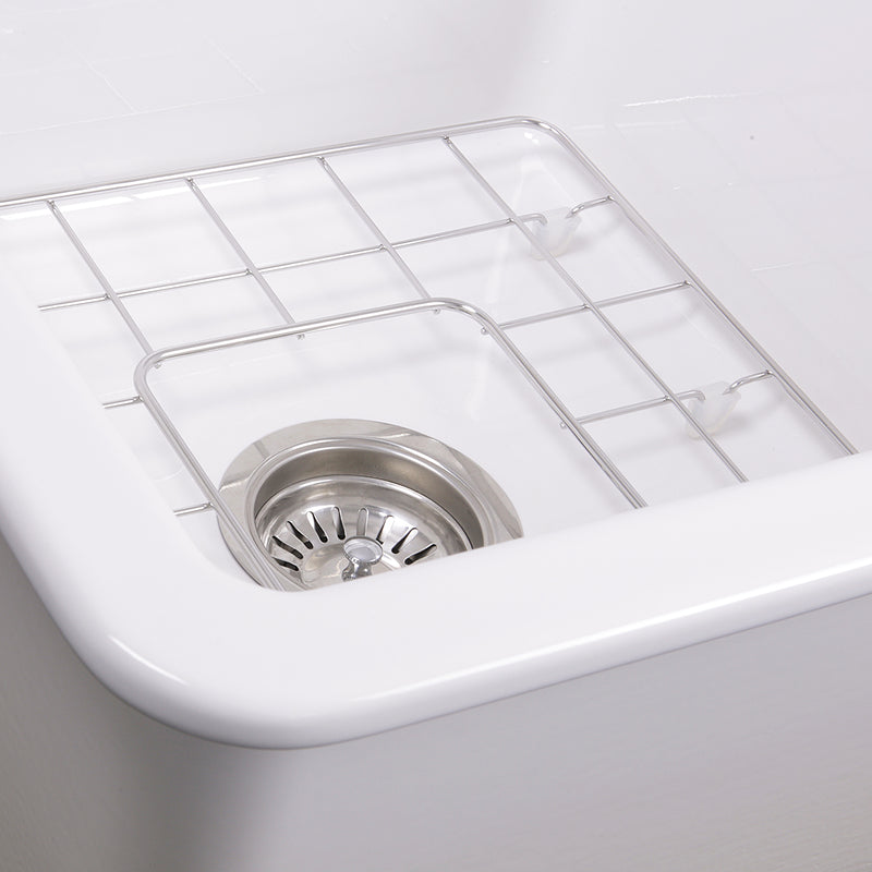 Nantucket Sinks Wellfleet-1818W close-up of the stainless grid and basket strainer in the white bowl
