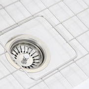Nantucket Sinks Wellfleet-2719W close-up of the basket strainer inside the stainless bottom grid