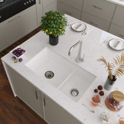 Nantucket Sinks Wellfleet-31OSW 60/40 double bowl sink in a white island with a brushed faucet