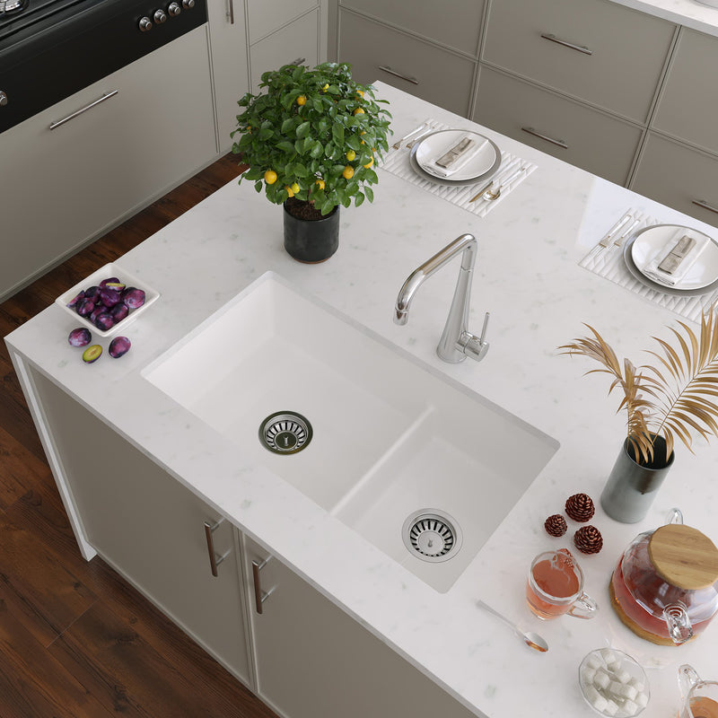 Nantucket Sinks Wellfleet-31OSW 60/40 double bowl sink in a white island with a brushed faucet