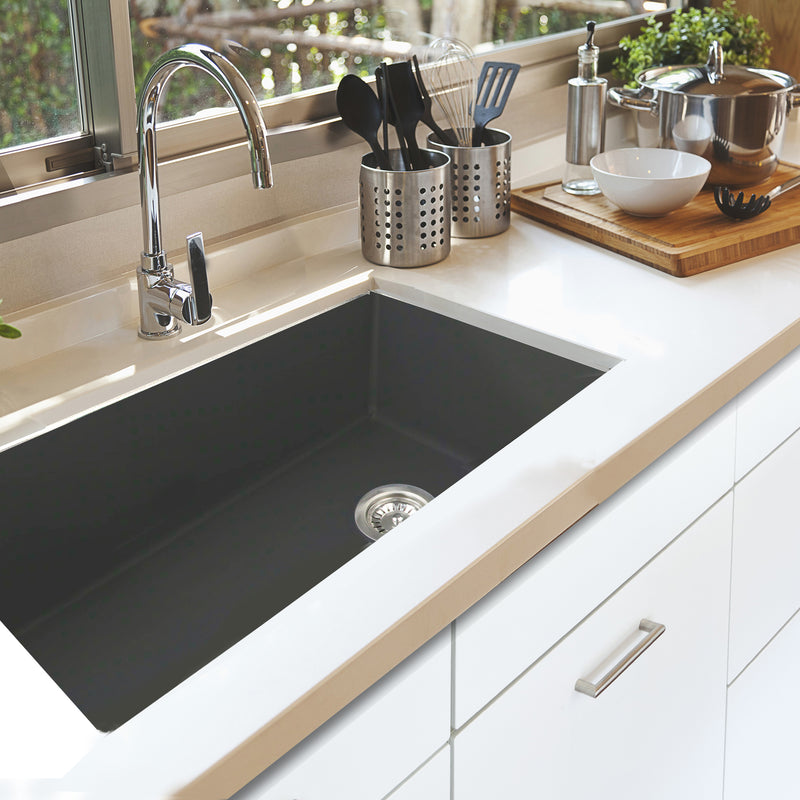 Nantucket Sinks Wellfleet-3419MatteBlack Matte Black single bowl sink undermounted in a white counter with chrome faucet