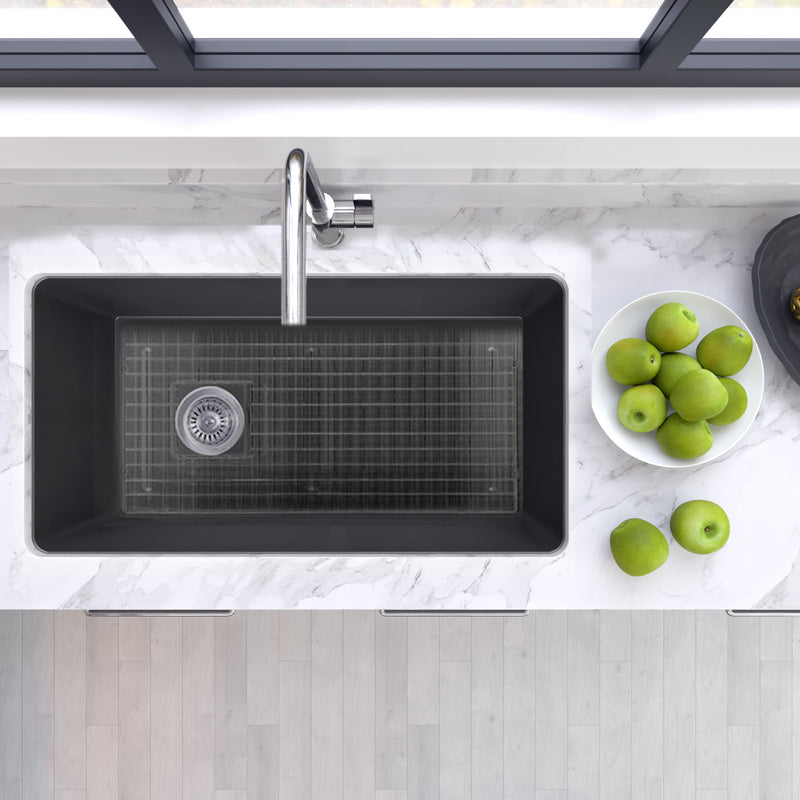 Nantucket Sinks Wellfleet-3419MatteBlack Matte Black single bowl sink from above in marble with grid and green apples