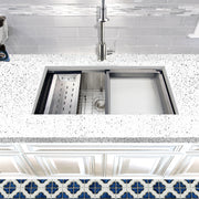 Nantucket Sinks ZR-PS-3620-16 installed in a speckled counter with colander and rinse tray