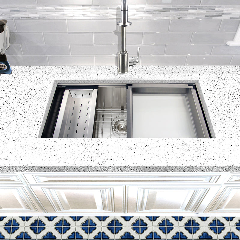 Nantucket Sinks ZR-PS-3620-16 installed in a speckled counter with colander and rinse tray