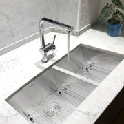 Nantucket Sinks ZR3219-OS-16 installed in white marble with a chrome faucet and grids