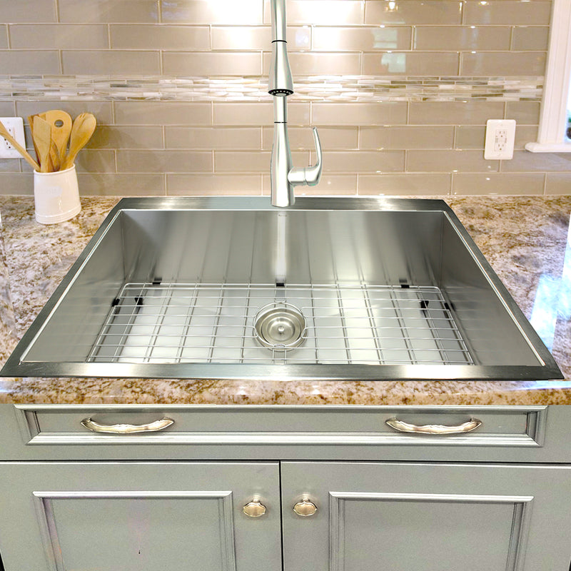 Nantucket Sinks ZR3322-S-16 installed in granite with the grid and a pull-down faucet