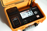 PressurePro differential pressure recorder open in its orange case, touchscreen on, thermal printer and Pressure Assist outlet