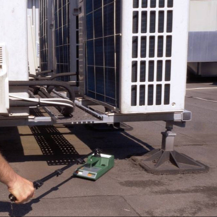 Tramex Roofing Master Kit - RMK A detailed image displaying the Tramex Roofing Master Kit with various components including an extension arm for accurate roof moisture testing.