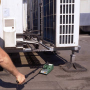 Tramex RWS - Roof and Wall Scanner: Image showing the Tramex RWS device in use for non-destructive testing on a roof surface, equipped with an extension arm for enhanced reach and accuracy.
