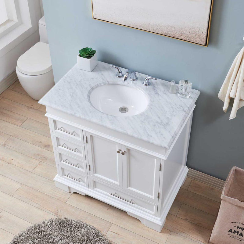 Silkroad Exclusive HYP-0212-WM-UWC-36 36" White single sink vanity, Carrara top, installed in a bathroom, angled view