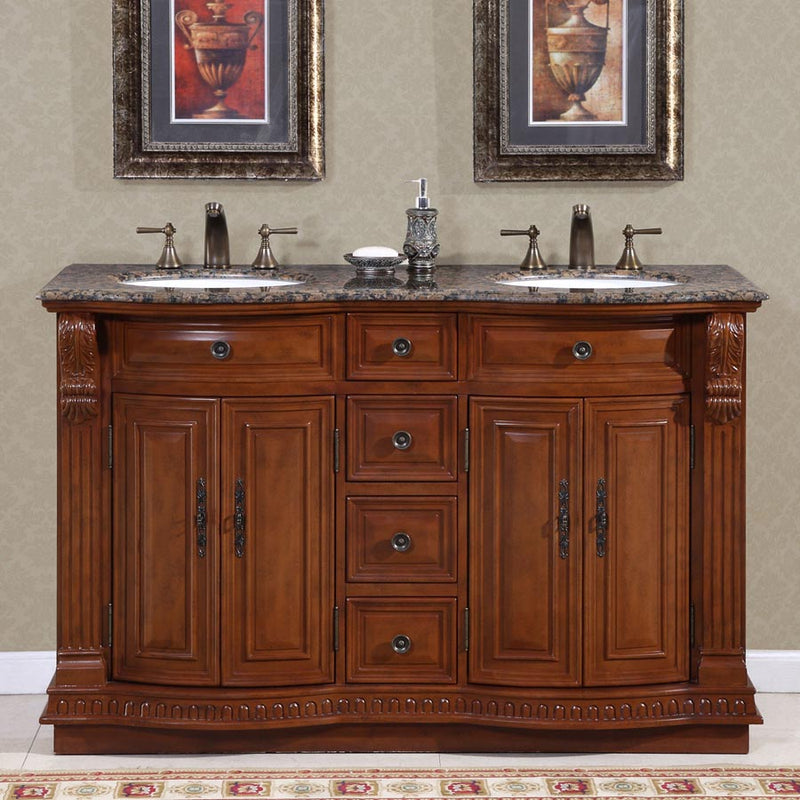 Silkroad Exclusive HYP-0223-BB-UWC-55 installed in a bathroom with antique brass widespread faucets