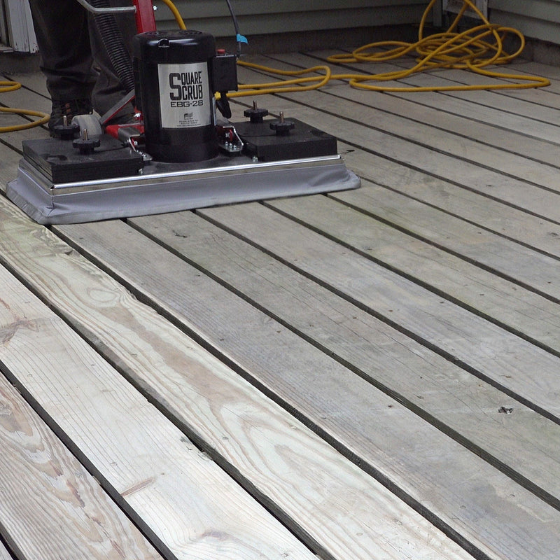 Wooden deck with a power tool and container on top