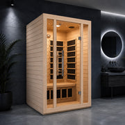 SteamSpa SC-SS0008-2P Ischia infrared sauna with glass door against a dark wall