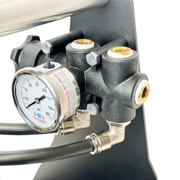 Tucker booster pump system pressure gauge and bypass manifold on the black frame