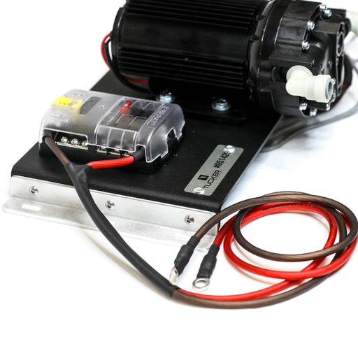 Tucker 12V RO booster panel angled view of the pump, fuse block and red power leads