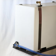 Tucker auxiliary 50 gallon tank at an angle with blue suction hose and top fitting