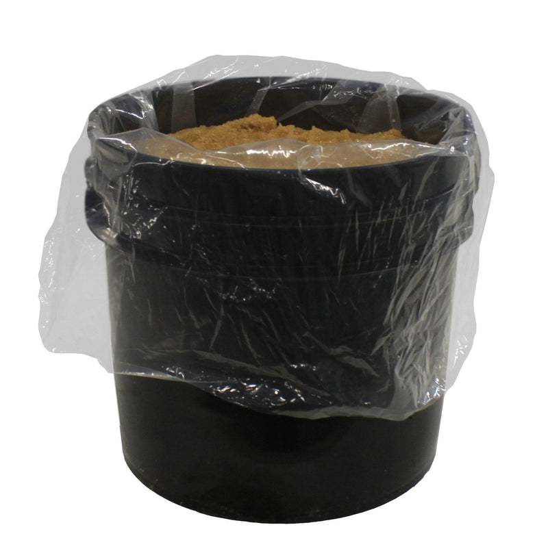 Tucker DI resin beads in an open black bucket with a clear liner bag