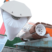 Tucker RTM solar robot close-up of the white brush roller and orange track drive