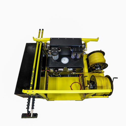 Tucker Ultimate Residential Skid from above with two hose reels, stored poles and brushes