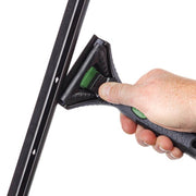 Unger ErgoTec Ninja Squeegee Handles, hand gripping the handle on a squeegee channel