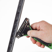 Unger ErgoTec Squeegee Handles, hand gripping the handle on a squeegee channel