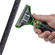 Unger ErgoTec SwivelLoc Handles 0°, hand gripping the handle on a squeegee channel