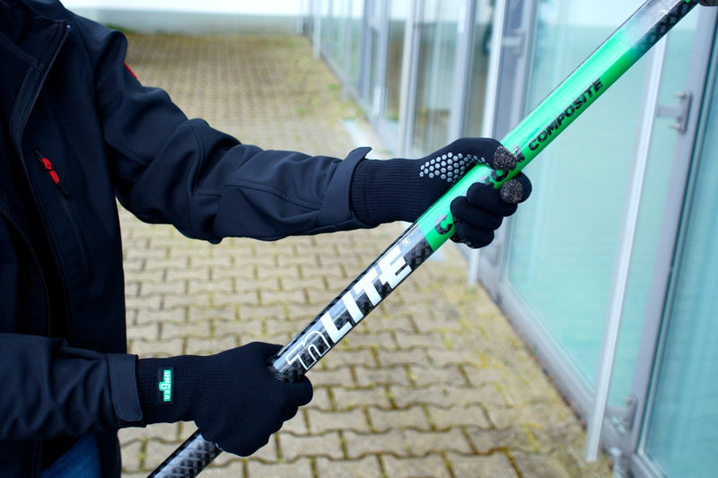 Unger ErgoTec Window Cleaning Gloves, holding a window pole