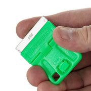 Unger Mini Scraper, scraper held between fingers