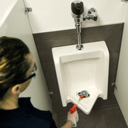 Unger NiftyNabber Grabber, picking up litter in a restroom