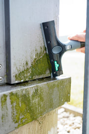 Unger Ninja Plastic Blade, scraping a dirty window ledge with a plastic blade