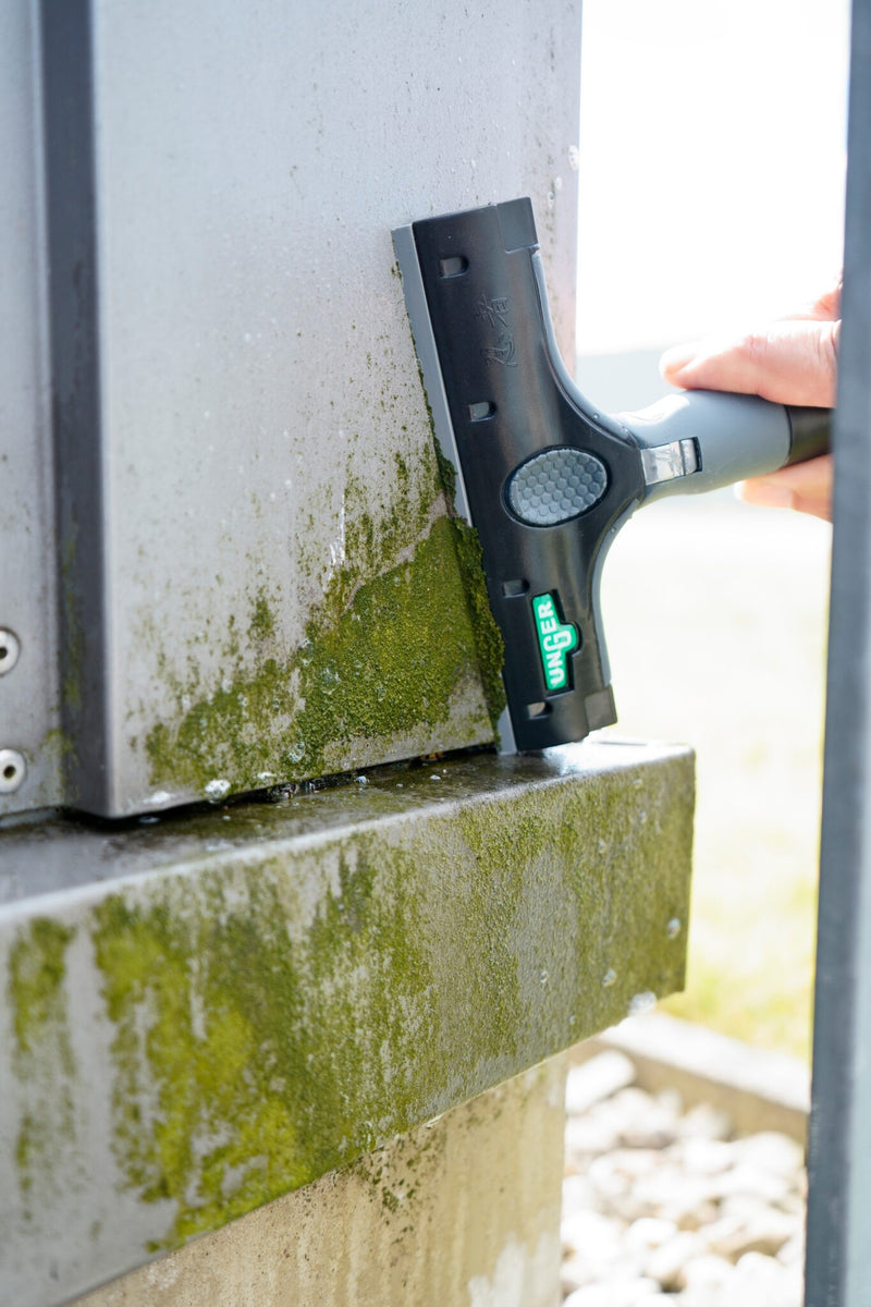 Unger Ninja Plastic Blade, scraping a dirty window ledge with a plastic blade