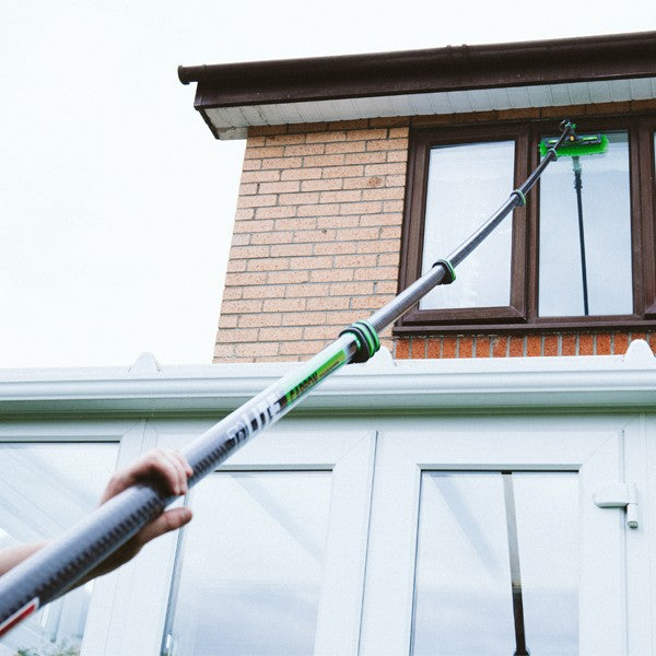 Unger nLITE Carbon Composite Pole, cleaning a house window