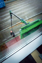 Unger nLITE Power Brush Complete, flagged 11"/28cm, washing a high window from the ground