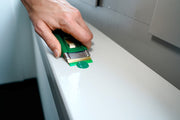 Unger Safety Scraper Plastic Blade, scraping a surface edge
