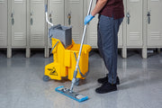 Unger Dual Compartment Mop Buckets, mopping a locker room beside the yellow bucket