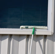 Unger Starter Pro Window Cleaning Kit, washing a high window with the strip washer on the pole
