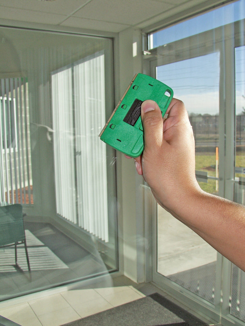 Unger Starter Pro Window Cleaning Kit, scraping glass with the ProTrim scraper