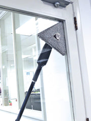 Unger Stingray Glass Washing Pads, cleaning a glass door with the pad on a Stingray tool