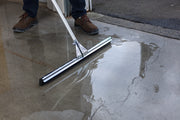 Unger WaterWand Floor Squeegee Heavy Duty, pushing water across a floor