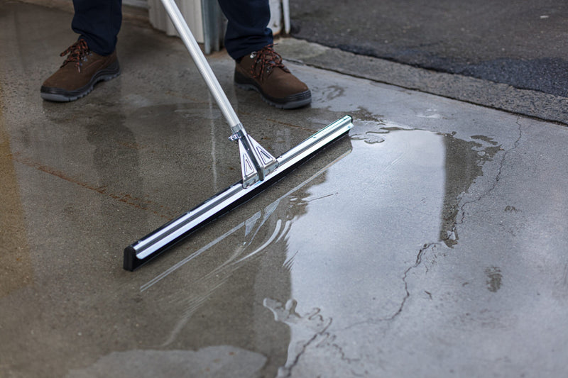 Unger WaterWand Floor Squeegee Heavy Duty, pushing water across a floor