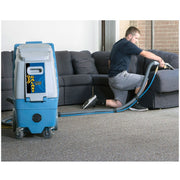 with man cleaning the upholstery using edic 17 gallon galaxy pro 220 psi heat ready extractor.